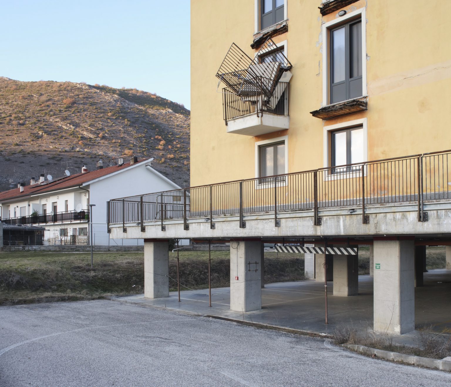 Homes of the C.A.S.E. (Sustainable and environmentally friendly anti-seismic complexes). Some of the structures were cleared due to structural problems. Preturo, L'Aquila, Italy, 2019.