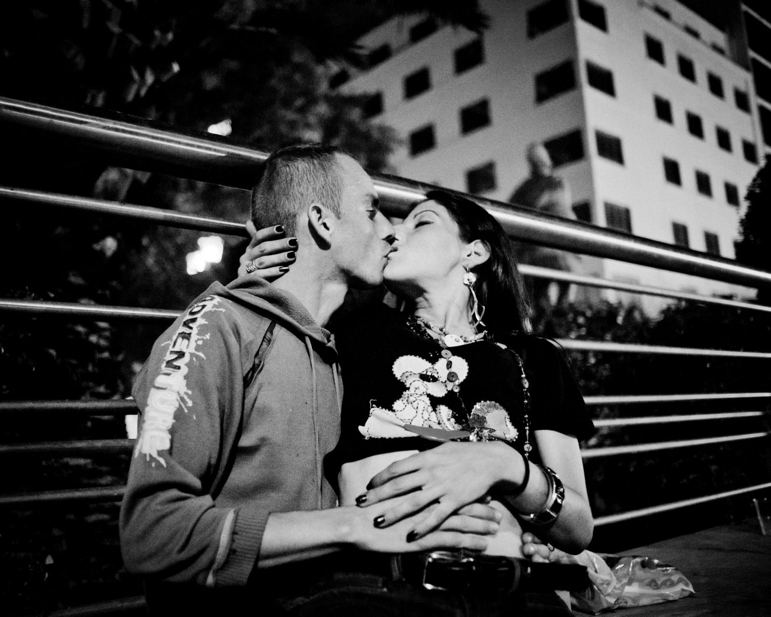 Maria and Kostas, both heroin addicts. Kissing in the Omonia square area, Athens, Greece. 2012