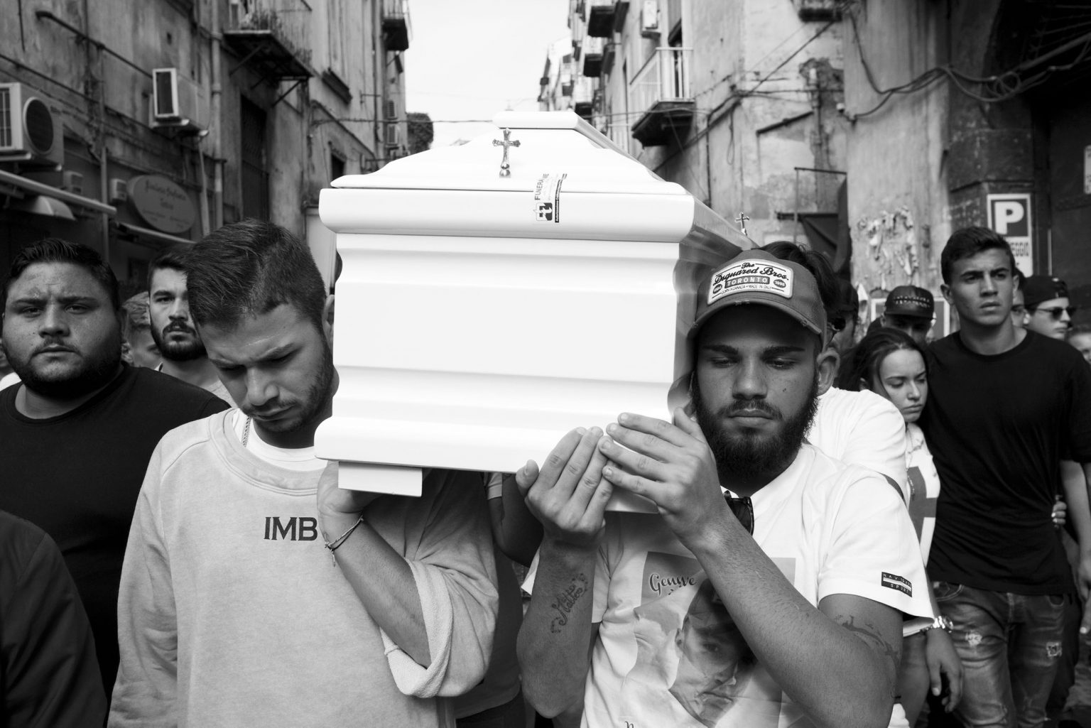 Genny Cesarano a 17 years old guy with previous convictions for robbery and possession of gun, was killed by a Camorra commando. The funeral of Genny, the friends bringing the coffin  in the streets of the quarter. Sanità neighborhood. Naples, Italy, 2015