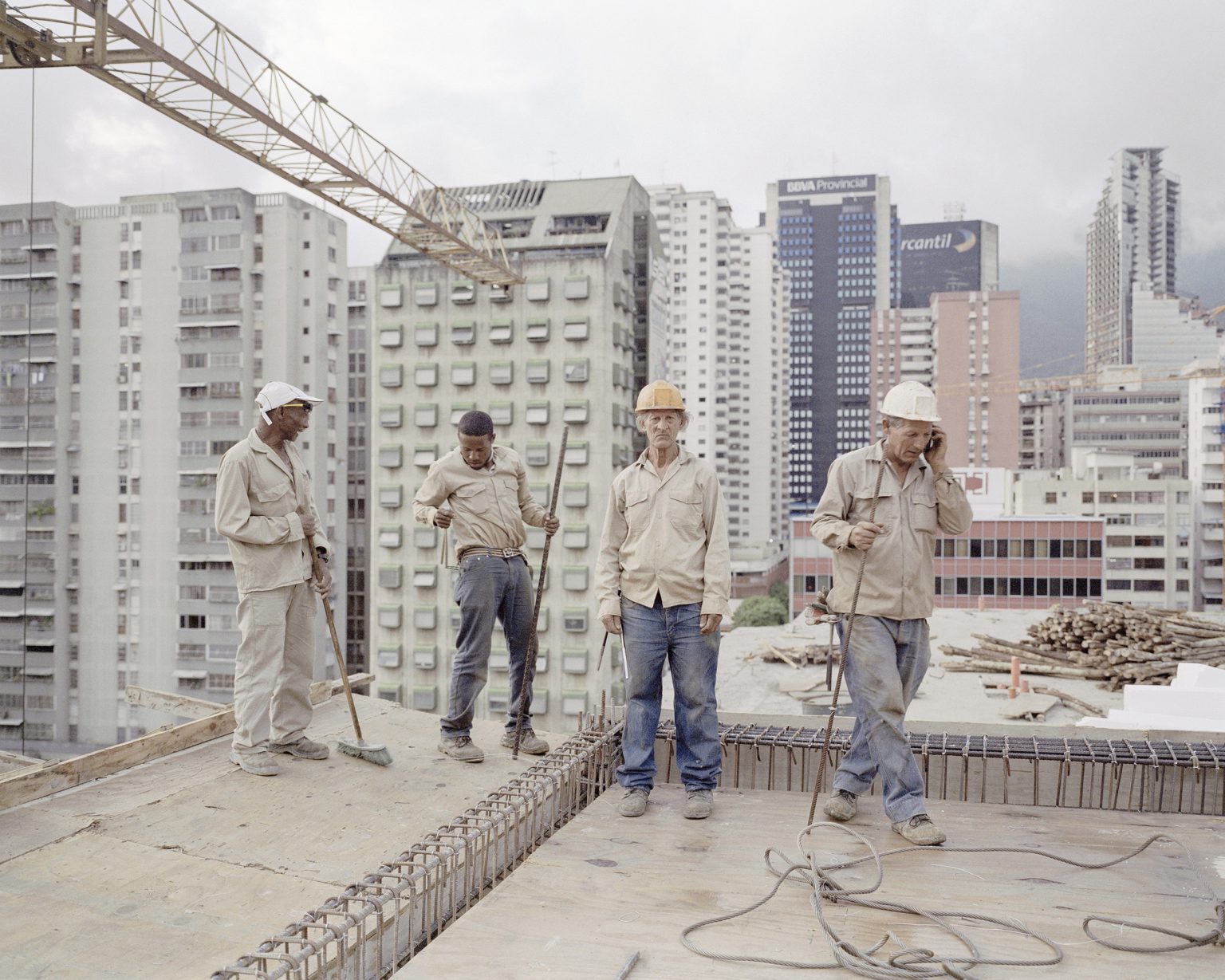 Some workers on the roof of a contruction site in Caracas. The building is part of the program "Mission Vivienda" to give houses to the poorest part of the population.