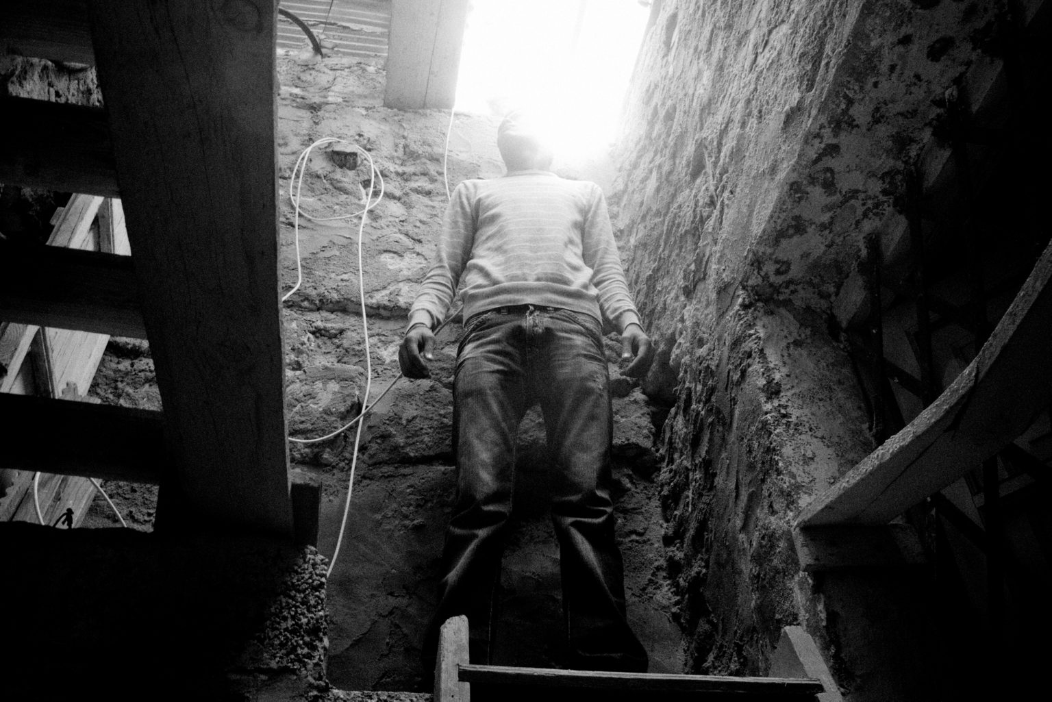 Lampedusa, April 2011-The story of Ahmed, one of the many young Tunisians landed on Lampedusa. Ahmed, a 23-year-old Tunisian who was being looked after by the Matinas, a Lampedusans family. The family gave him a bed, clothes,food, and they lived togheter for a year.
Ahmed in the house of the local family.

Lampedusa, aprile 2011-La storia di Ahmed, uno dei tanti giovani tunisini sbarcati a Lampedusa. Ahmed, un tunisino di 23 anniè stato accudito dai Matinas, una famiglia lampedusana. La famiglia gli ha dato un letto, dei vestiti e  cibo. Hanno vissuto insieme per un anno.Ahmed in casa della famiglia.
