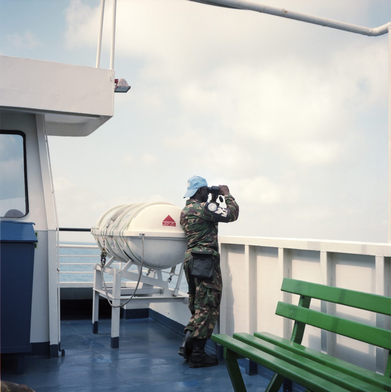 Naqura, Lebanon. A UNIFIL tanzanian military police officer observes the coast as the ferry Carolyn, used by UNIFIL to move troops between Beirut and south Lebanon, navigates.