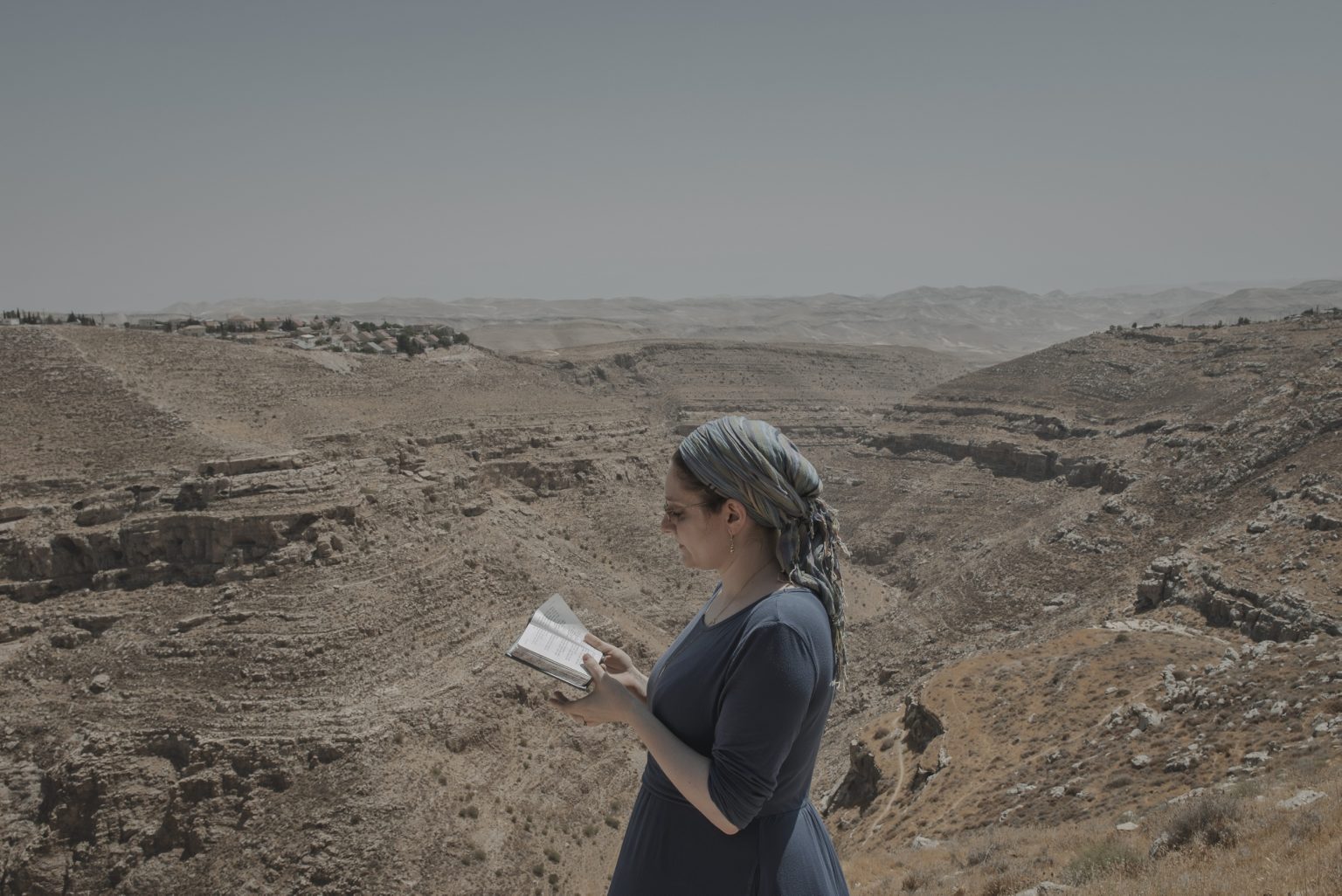 16.15604503 Daniella Levy, a novelist and self-described "ambivalent settler," at the Tekoa settlement in the occupied West Bank, Aug. 31, 2021.  Two journalists for The New York Times drove the length of Israel to discover what it means to be Israeli today. They met a kaleidoscope of people, searching for belonging but far apart on how to find it. (Laetitia Vancon/The New York Times)     <span style="color: #ff0000">*** SPECIAL   FEE   APPLIES ***</span> *** Local Caption *** 16.15604503