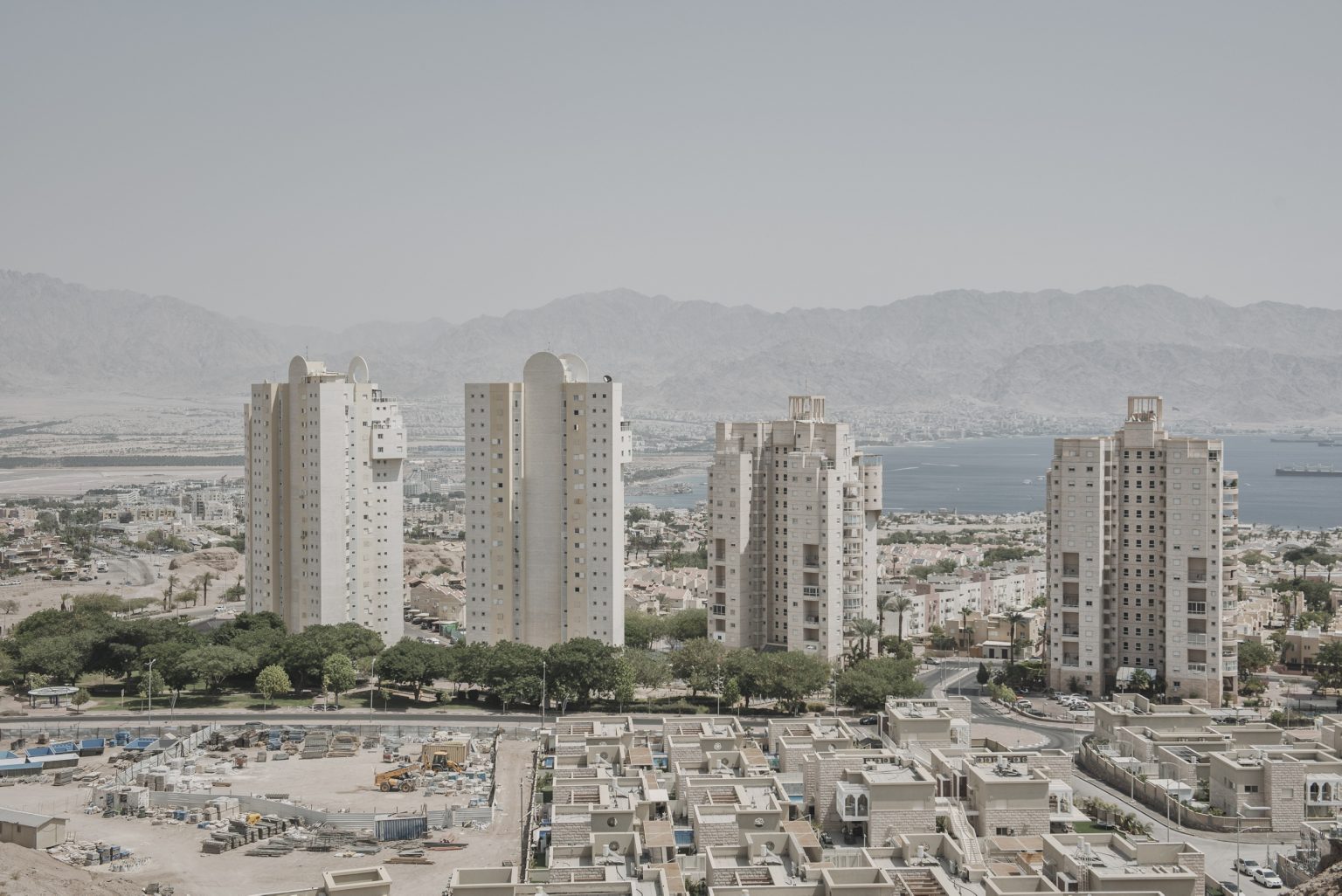 16.15604508 High-rise apartments and hotels in Eilat, Israel, Sept. 3, 2021. Two journalists for The New York Times drove the length of Israel to discover what it means to be Israeli today. They met a kaleidoscope of people, searching for belonging but far apart on how to find it. (Laetitia Vancon/The New York Times)     <span style="color: #ff0000">*** SPECIAL   FEE   APPLIES ***</span> *** Local Caption *** 16.15604508