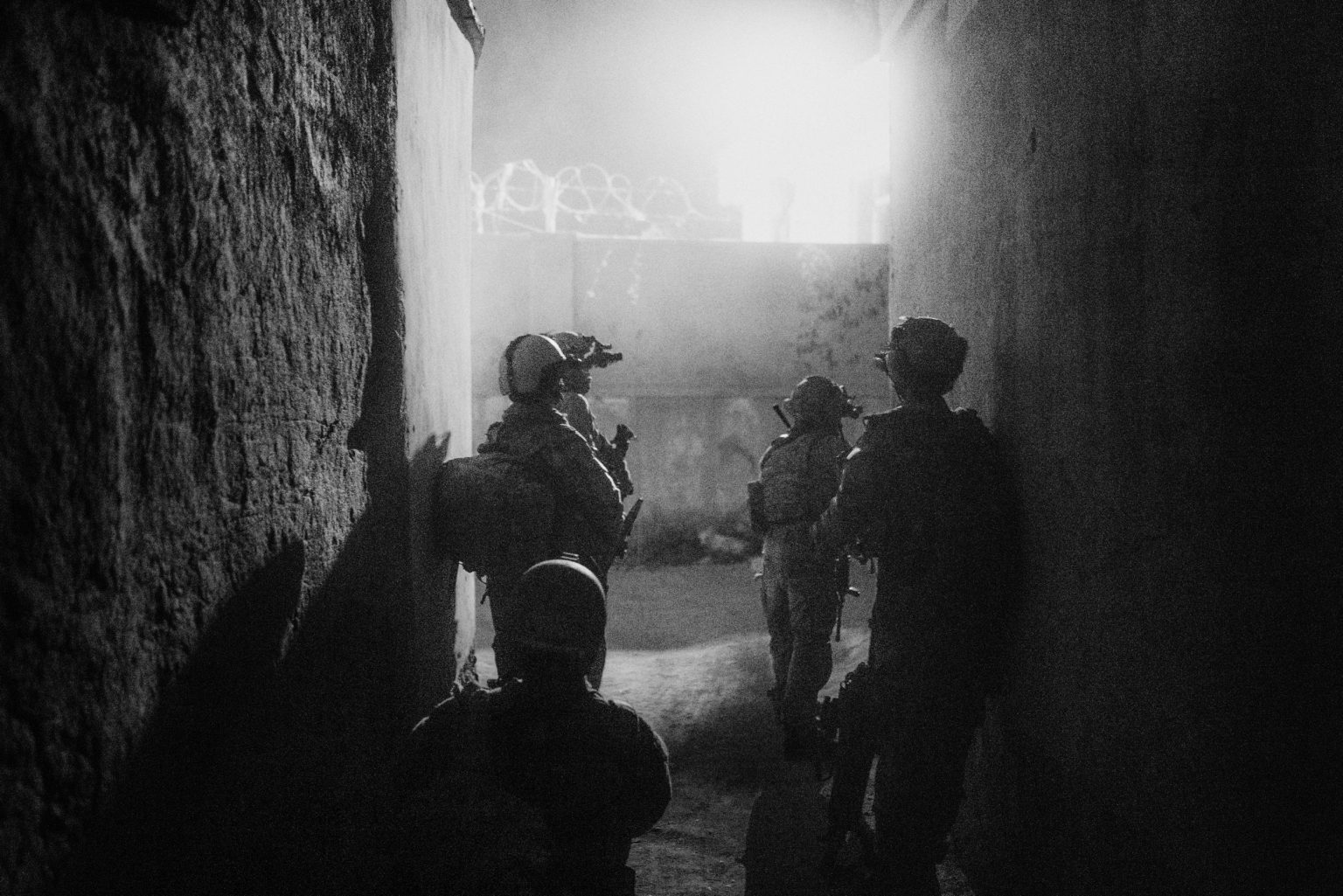 KUNDUZ, AFGHANISTAN - JULY 15, 2021:
Elite special forces unit Ð known as KKA or Afghan Special Unit Ð take shelter from gunfire during a night operation. 
After American troops began leaving Afghanistan in early May 2021 the Taliban mounted an offensive and took control of many district in northern Afghanistan. Security forces were struggling to hold the besieged city of Kunduz.

(Photo by Lorenzo Tugnoli/ Washington Post/ Contrasto)