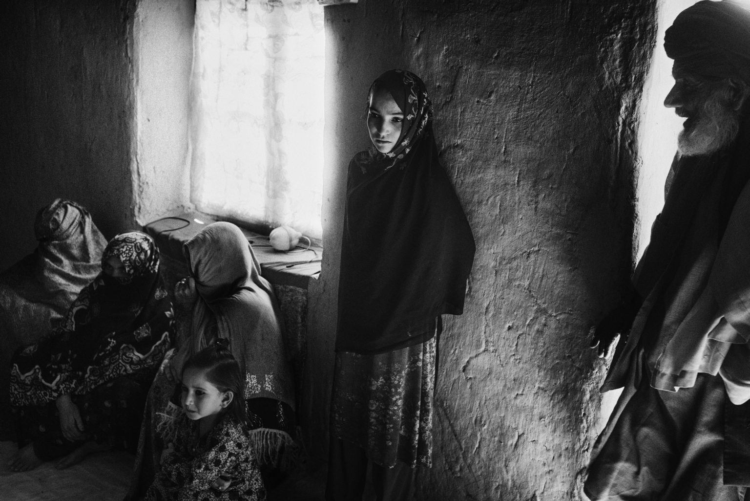 LASHKAR GHA, AFGHANISTAN - MAY 26, 2021:
Civilian take shelter inside a house in Helmand while fighting between the Taliban and the Afghan security forces rages nearby. 
Some civilians returned to their houses in the district of Nawa, near the city of Lashkar Gha despite fighting still ongoing in the area.
After American troops began leaving Afghanistan early May the Taliban mounted an offensive near the southern city of Lashkar Gha. Afghan security forces were struggling to hold the besieged city in Helmand province.

(Photo by Lorenzo Tugnoli/ Washington Post/ Contrasto)