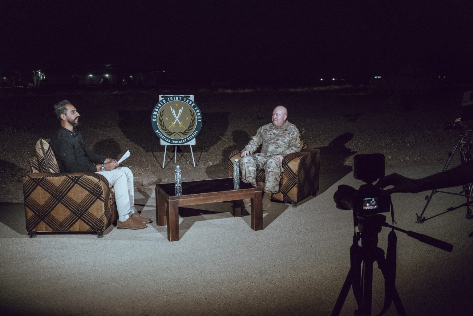 SYRIA. August 25, 2021 - U.S. Army Col. Wayne Marotto, spokesman for Operation Inherent Resolve, gives an interview to a local Syrian TV, inside a compound of a remote U.S. Army combat outpost in northeastern Syria, known as RLZ.