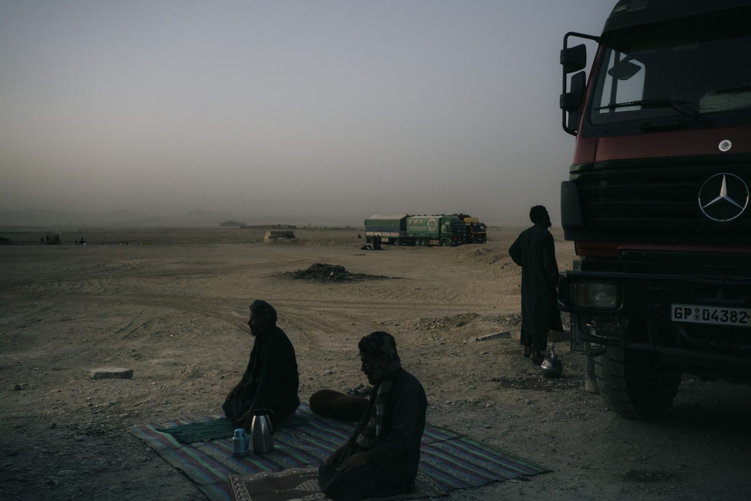 ZABUL, AFGHANISTAN - OCTOBER 19:
Truck drivers pray in a resting area outside the city of Kandahar in the evening.
(Photo by Lorenzo Tugnoli/ The Washington Post)