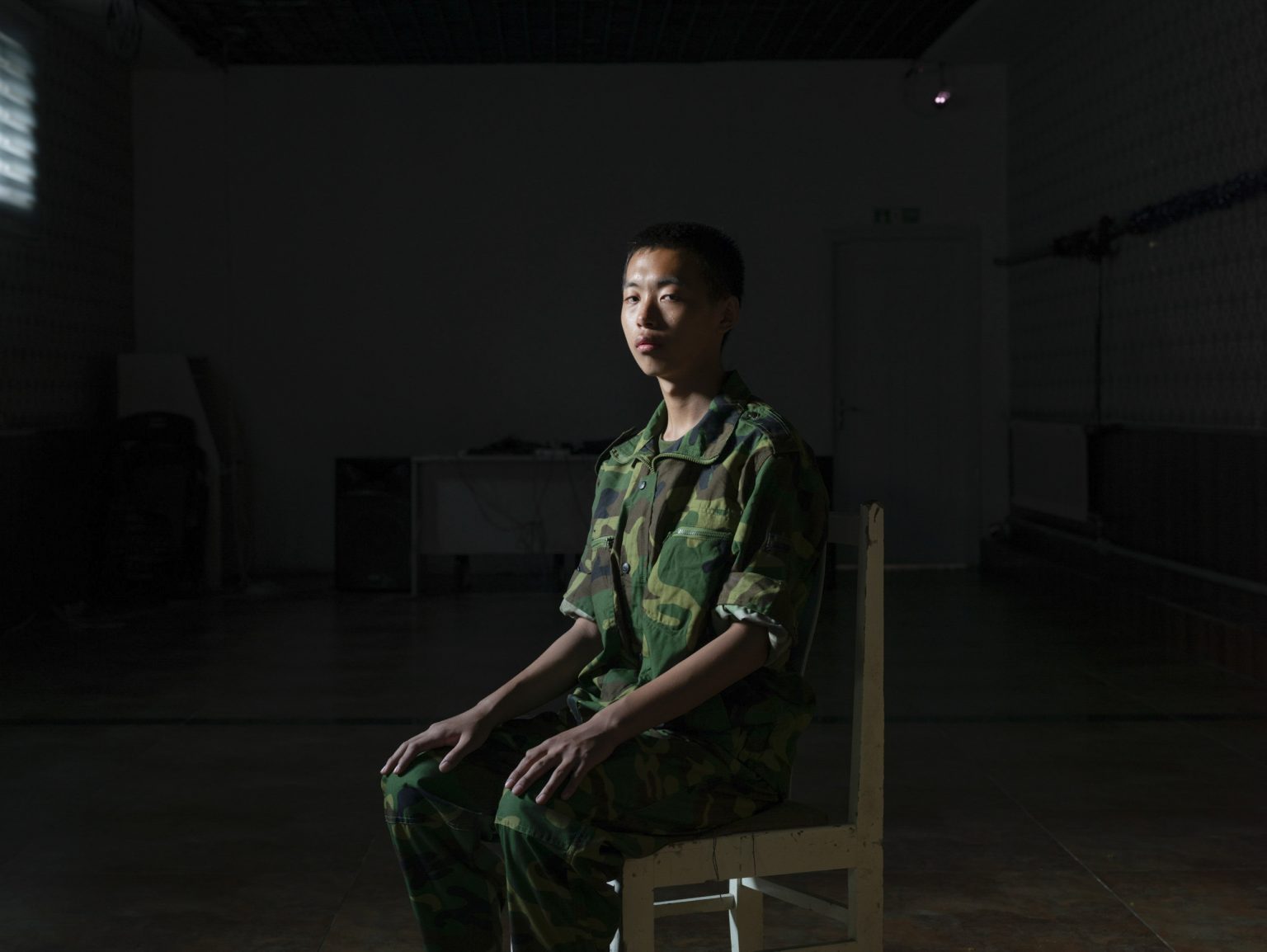 China, Jinan, Shandong province, October 2015: portrait of Dong Xiao Shuai, a 15 years old boy in the "Ya Bo center", a military boot-camp for reeducation of young people who are suffering from excessive online game playing. Dong Xiao Shuai is living in the boot-camp since 1 months.