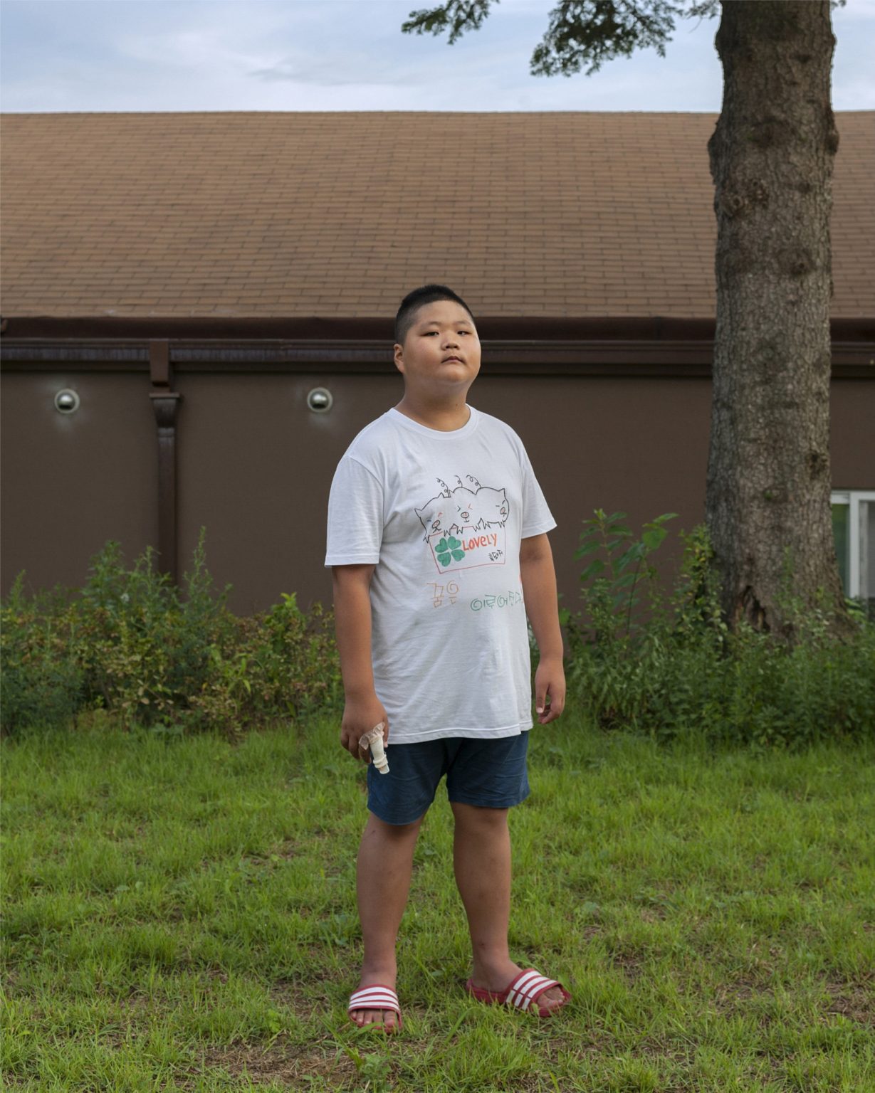 Republic of Korea, North Jeolla province, Muju, September 2015: portrait of a 8-years-old patient suffering by internet addiction at the National Center for Youth Internet Addiction Treatment commissioned by the Ministry of Gender Equality & Family. The boot-camp is held in a school and last three weeks. During this time the internees can't use any digital devices.