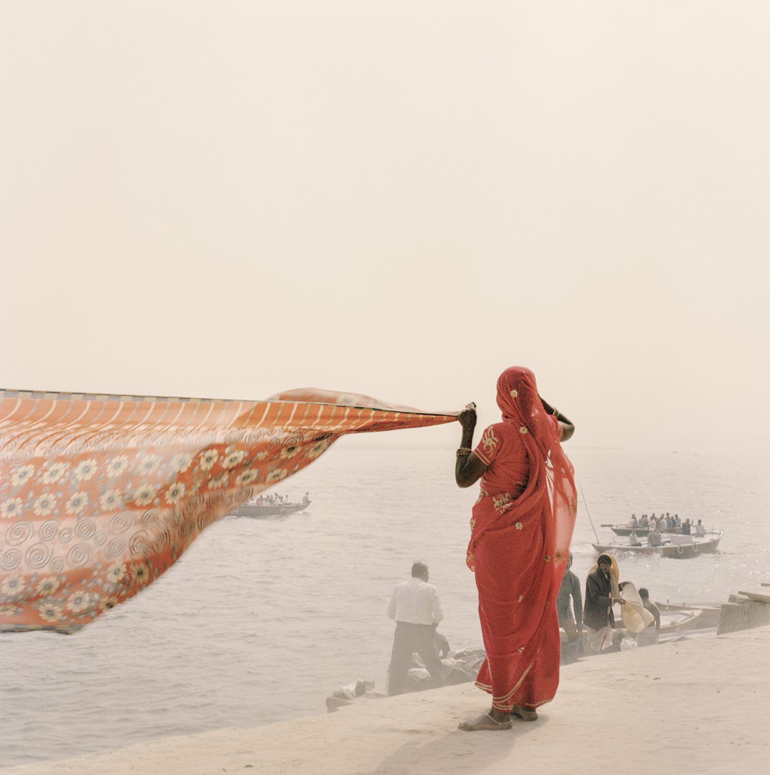 Hindu devotee preparing to perform the sacred ablutions in the waters of Varanasi.
