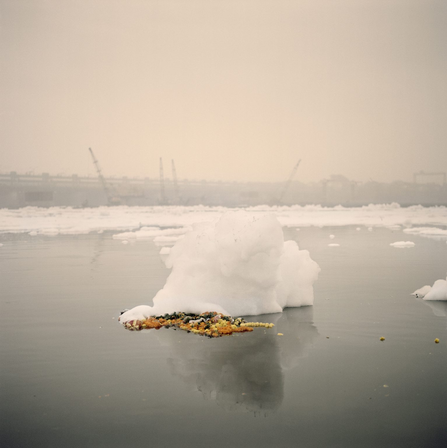 Icebergs of foam made of chimical waste dumped by factories along the Yamuna river.