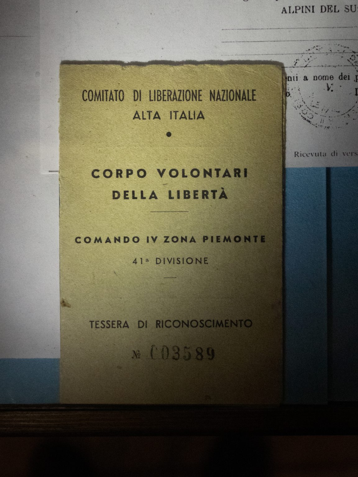 Recognition document of the "Corpo Volontari Della Libertà" (partisans) inside the Resistance museum in Mompantero. The Susa Valley is historically famous for the importance of its partisan movement and the age of the young people who joined the movement corresponds to the age of the young people who are joining the "Giovani No Tav" movement today.
Monpantero (Turin), Italy, March 2022. 

><

Documento di riconoscimento dei Corpo Volontari Della Libertà (dei partigiani) allinterno del museo di Resistenza di Mompantero. La Valle di Susa è storicamente famosa per limportanza del suo movimento partigiano e letà dei ragazzi che ne entravano a far parte corrisponde alletà dei giovani che oggi si uniscono al movimento Giovani No Tav. 
Monpantero (Torino), Italia, marzo 2022