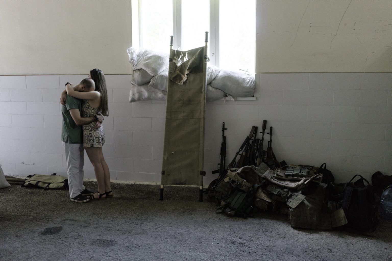 01573059 UKRAINE, Kramators'k. June 16, 2022 - A military doctor hug a woman inside the Kramators'k hospital.*** SPECIAL   FEE   APPLIES *** *** Local Caption *** 01573059